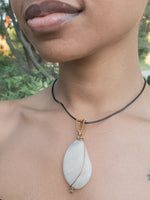 Load image into Gallery viewer, up close view of the Sakura Pendant on a model - BellaChel Jeweler