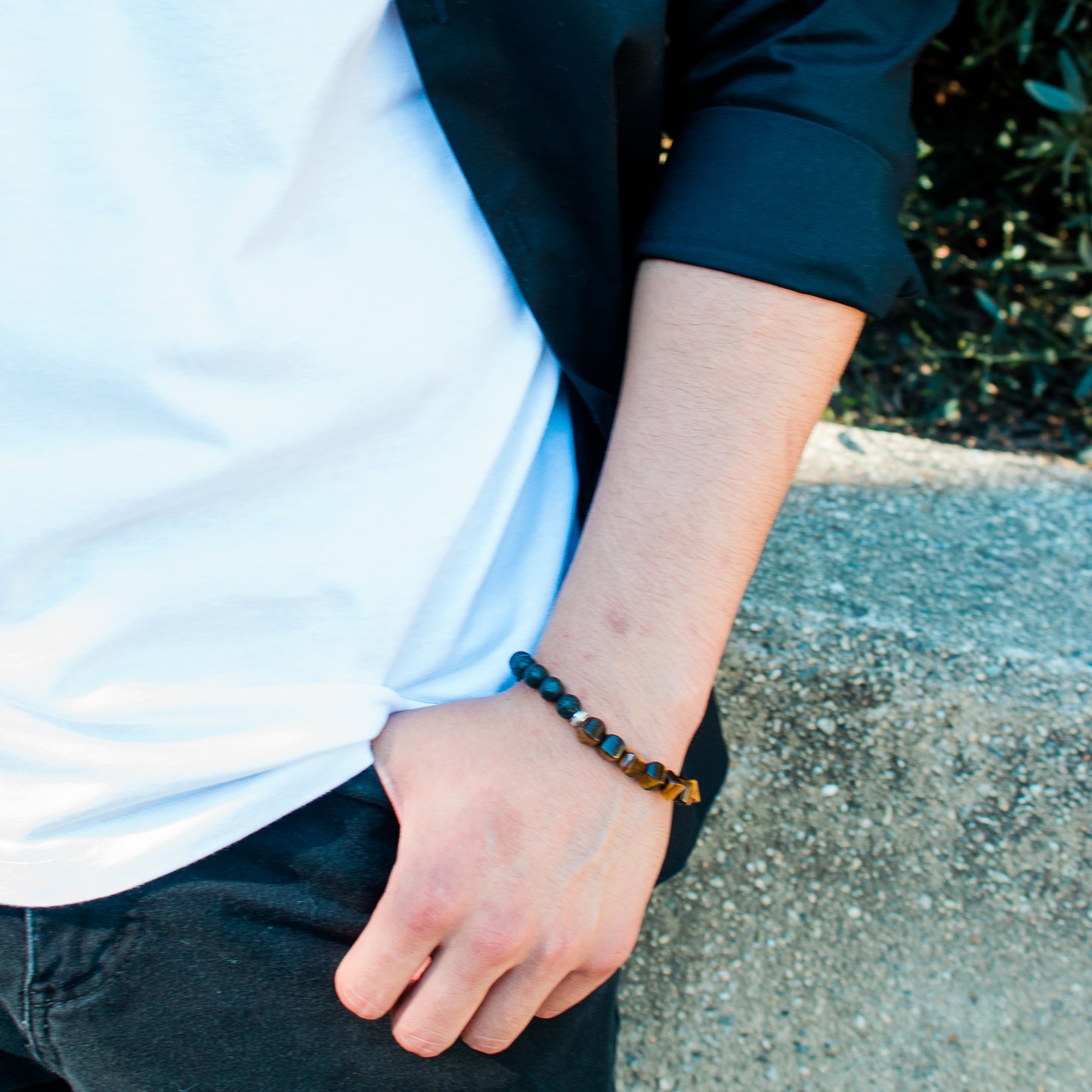 Tiger Eye Cushion Bead & Lava Stone Bracelet, up close view on a male model - BellaChel Jeweler