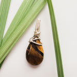 Load image into Gallery viewer, Real Tiger Eye Teardrop Pendant designed in Sterling Silver. One-of-a-Kind - Close-up front view - BellaChel Jeweler
