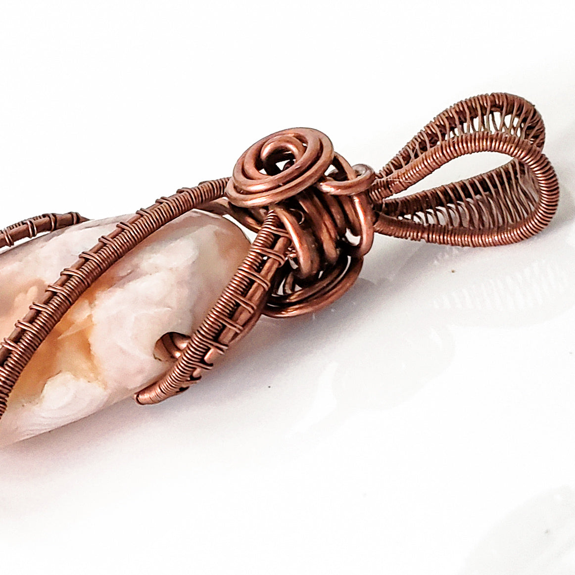 Close up of Antique Copper weaving on the Cherry Blossom Agate - BellaChel Jeweler