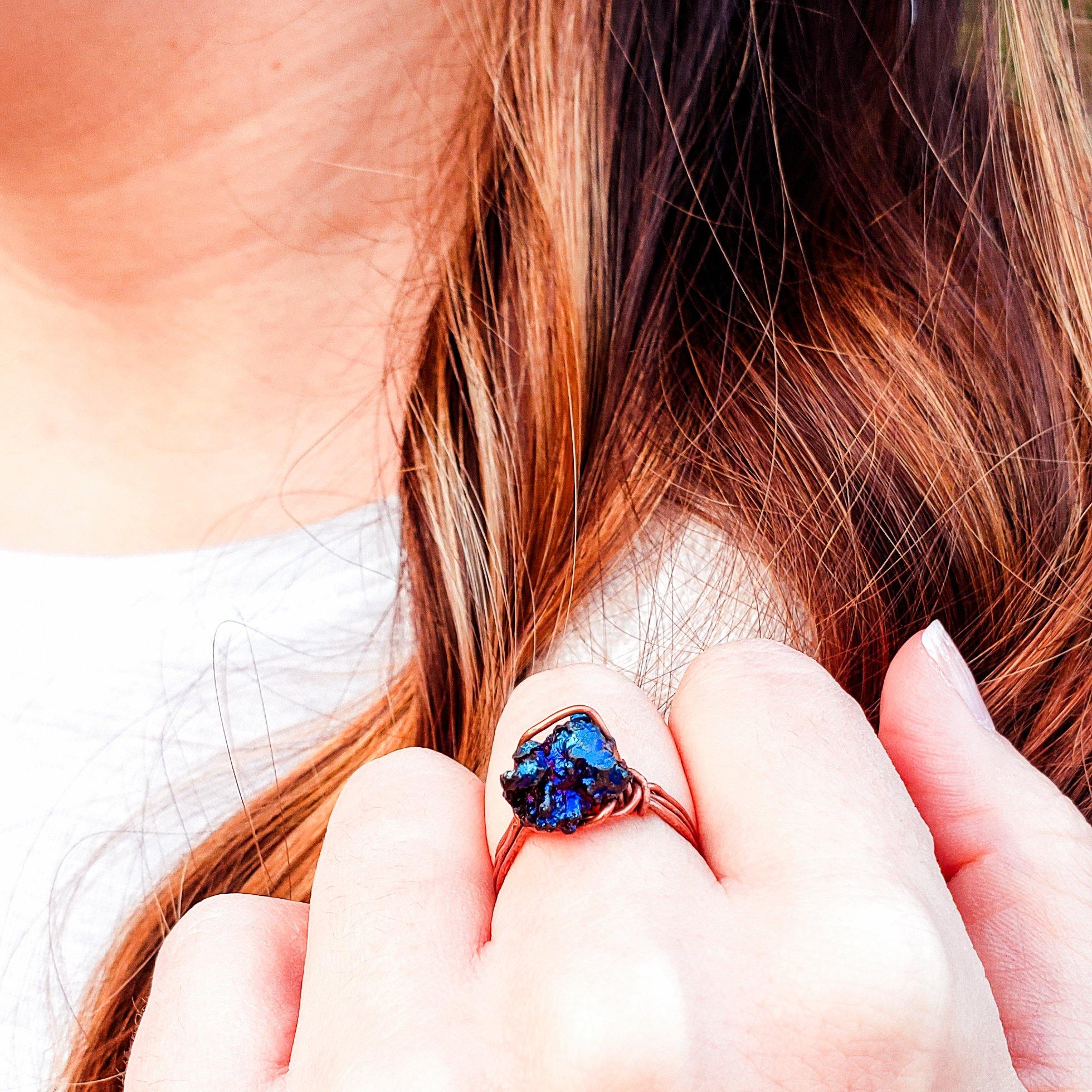 Peacock Ora Ring in Antique Copper top view shown on models hand - BellaChel Jeweler