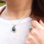 Load image into Gallery viewer, Laguna Collection - Beautifully Unique Turquoise Pendant in Sterling Silver front view on person - BellaChel Jeweler
