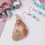 Load image into Gallery viewer, Laguna Collection - several Larimar Rings, Angelite Bracelet and matching earrings, and Fossil Agate Pendant close up picture - items sold separately - BellaChel Jeweler 
