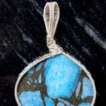 Cargar imagen en el visor de la galería, Laguna Collection - Beautiful Blue Turquoise and Pyrite Pendant weaved in Sterling Silver close-up view of the weaving detail - BellaChel Jeweler
