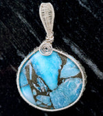 Cargar imagen en el visor de la galería, Laguna Collection - Beautiful Blue Turquoise and Pyrite Pendant weaved in Sterling Silver - BellaChel Jeweler

