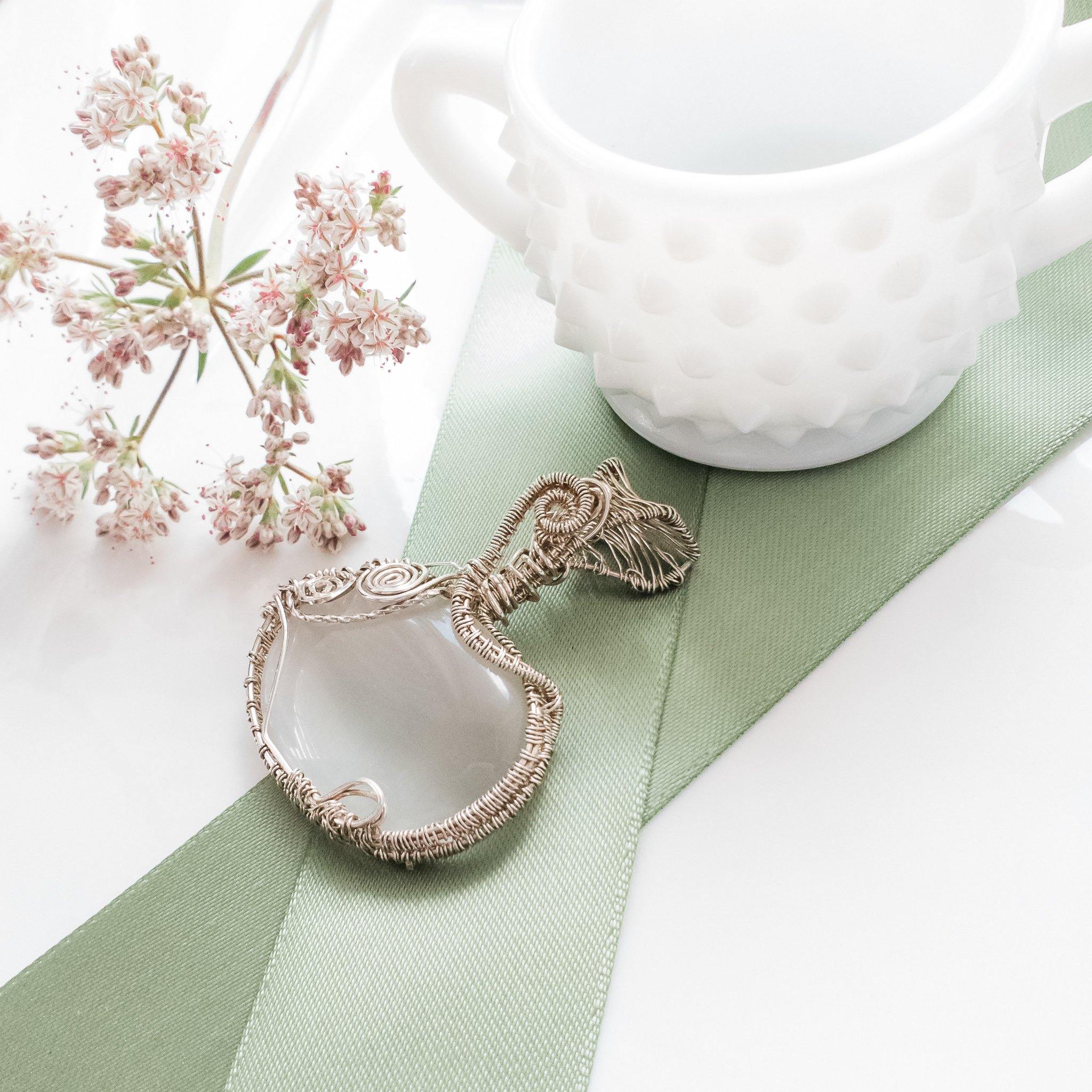 Elegant Statement Piece White Cats Eye Pendant in Sterling Silver top side view - Bellachel Jeweler