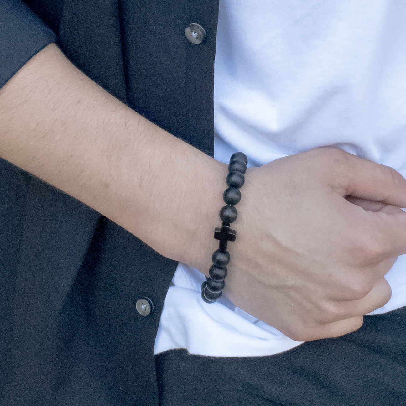 Viking Collection - Real Shungite Bracelet with Cross, 10mm bead - close-up view on a male model- BellaChel Jeweler