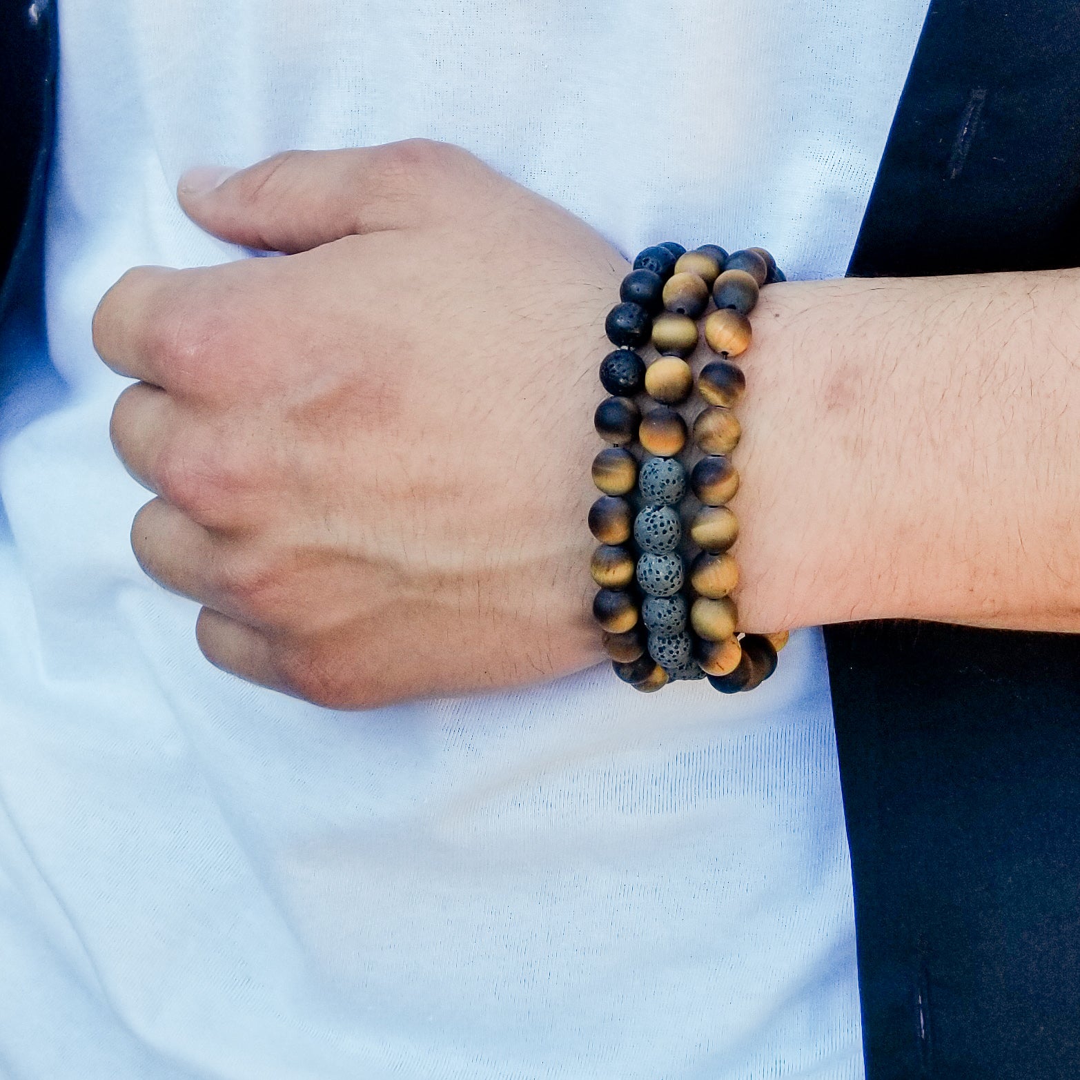 Tiger Eye & Lava Stone Bracelet - worn on a model with 2 other bracelets - BellaChel Jeweler