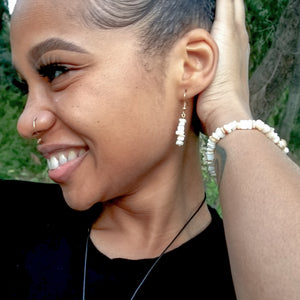 Stunning Seashell Bracelet & Earrings with Cubic Zirconia Accent shown on a model - BellaChel Jeweler