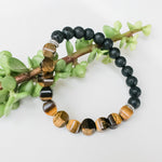 Load image into Gallery viewer, Tiger Eye Cushion Bead &amp; Lava Stone Bracelet, up close view - BellaChel Jeweler
