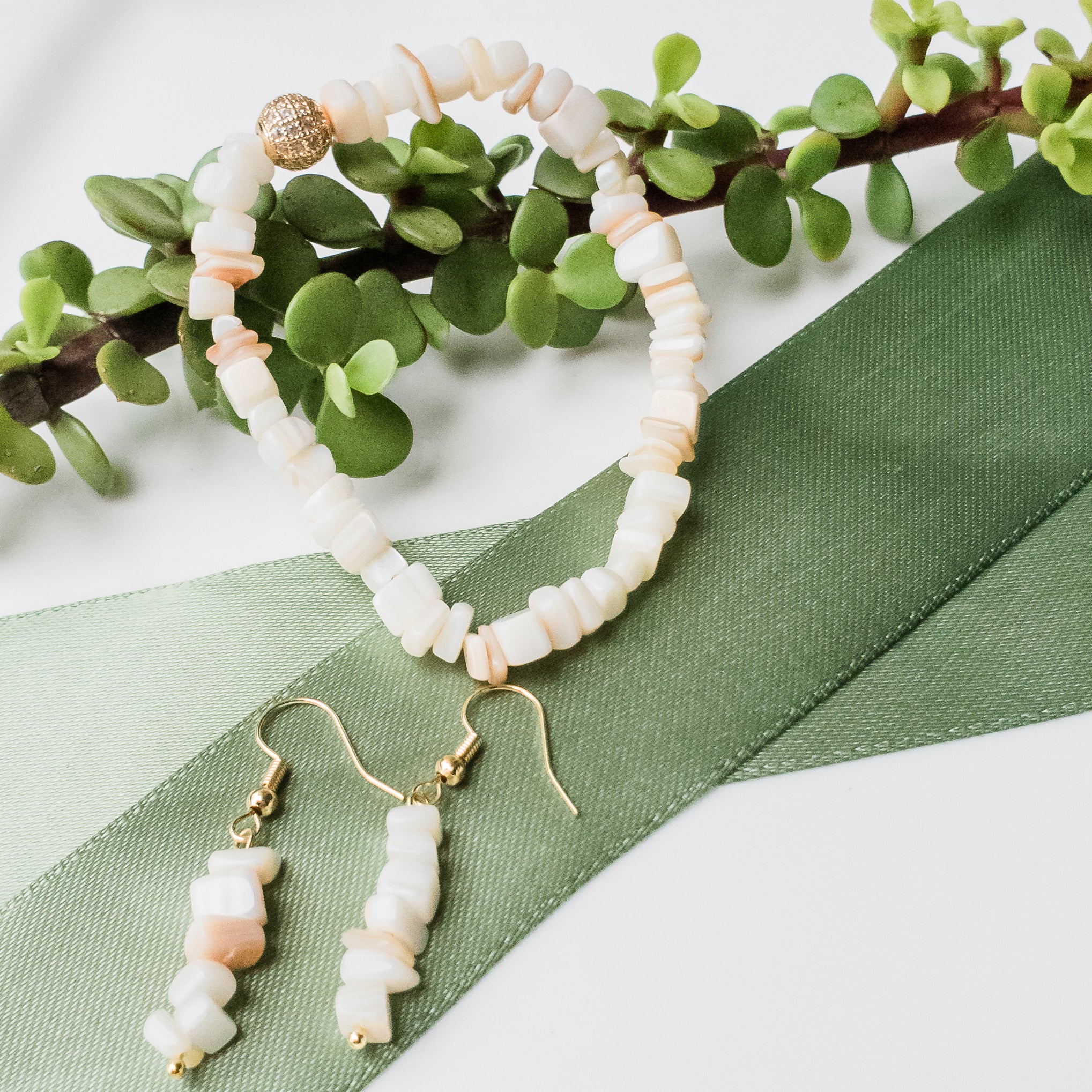 Up close picture of Gorgeous Seashell Bracelet & Earrings with Gold Cubic Zirconia Accent - BellaChel Jeweler