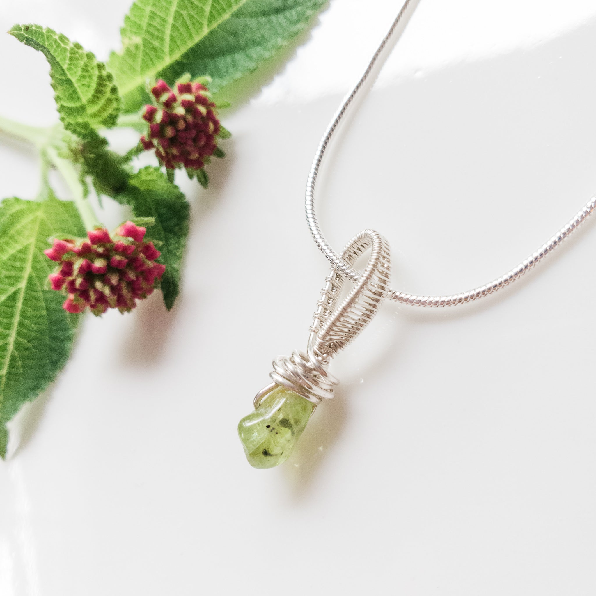 Rio Collection - Dainty Peridot Pendant Necklace in Sterling Silver close-up view - BellaChel Jeweler