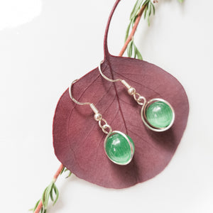 Signature Collection - Green Cats Eye Earrings Wrapped in Sterling Silver - Close-up view - BellaChel Jeweler