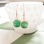 Load image into Gallery viewer, Green Cats Eye Earrings Wrapped in Sterling Silver - Close-up view - BellaChel Jeweler
