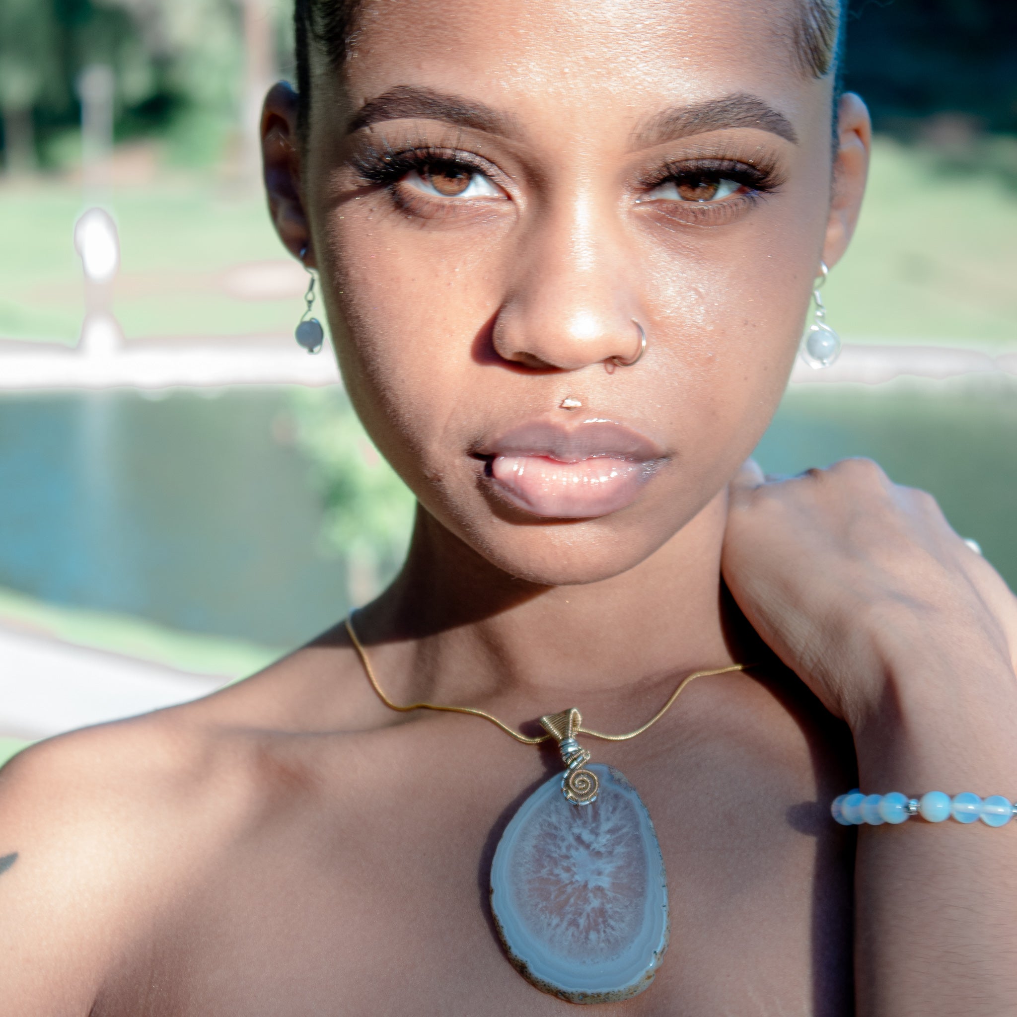 Celestial Collection - Model wearing Geode Necklace, Opalite Bracelet and Opalite Earrings, sold separately - BellaChel Jeweler