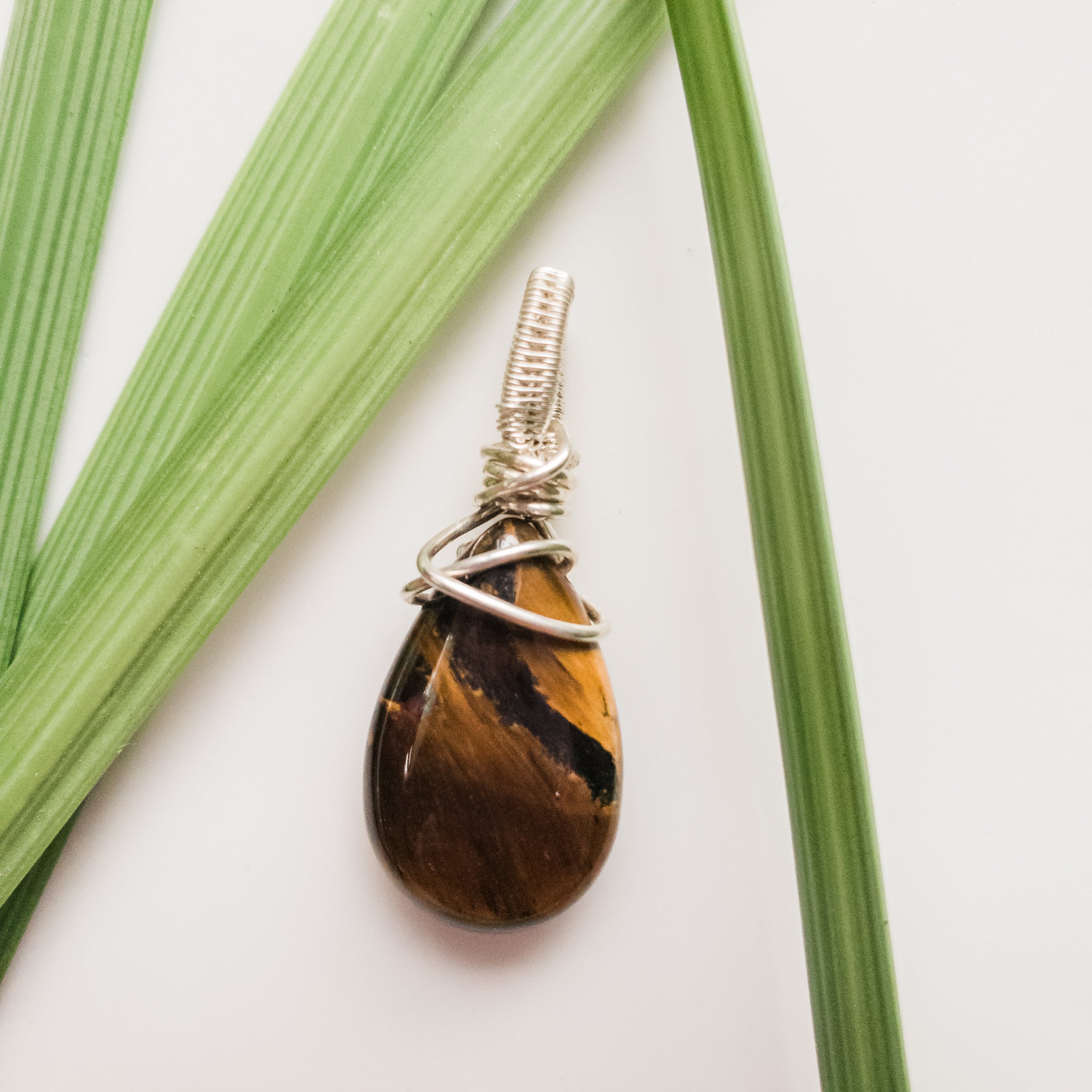 Real Tiger Eye Teardrop Pendant designed in Sterling Silver. One-of-a-Kind - Close-up front view - BellaChel Jeweler